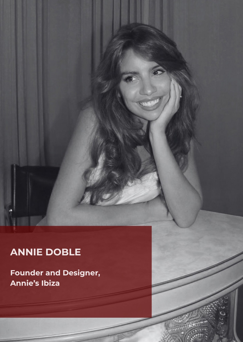 Annie Doble, founder and designer of Annie&rsquo;s Ibiza, photographed in black and white leaning on a table.