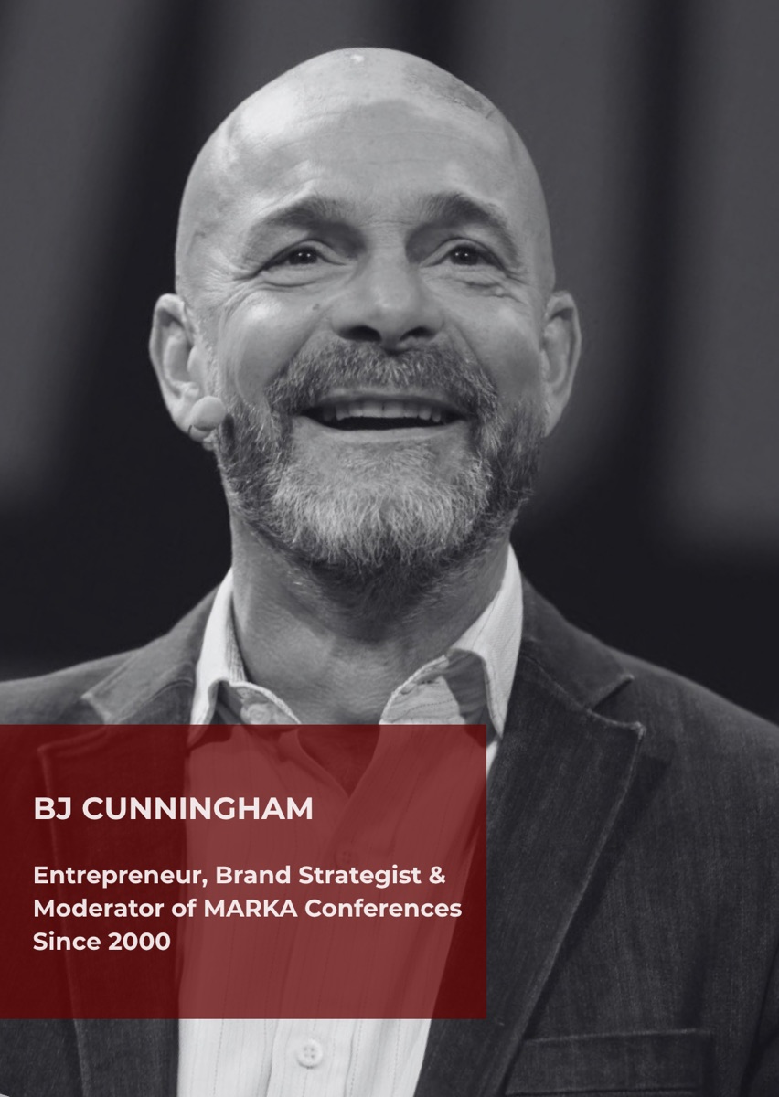 BJ Cunningham, entrepreneur and brand strategist, photographed in black and white laughing on stage.