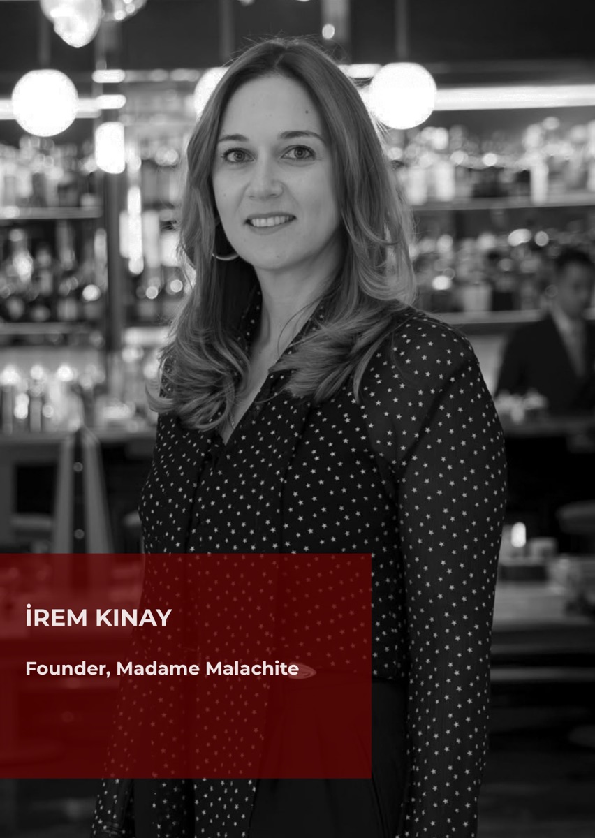 İrem Kınay, founder of Madame Malachite, photographed in black and white in a bar.