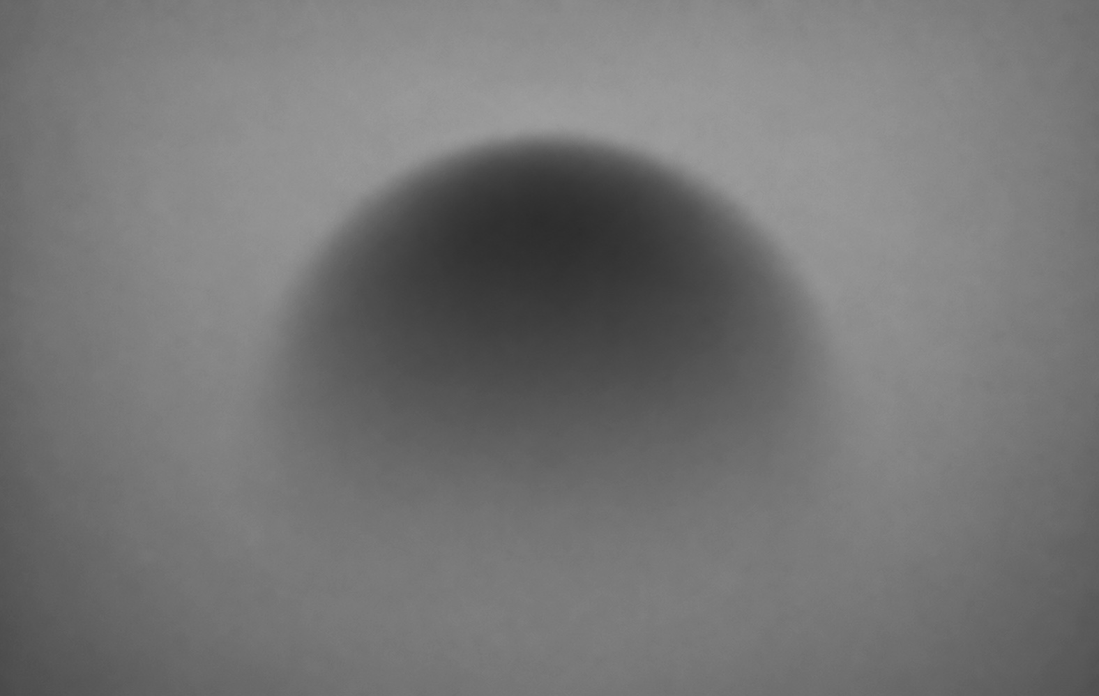 A soft-focus dome form, lit from above.